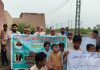 School enrollment awareness walk held